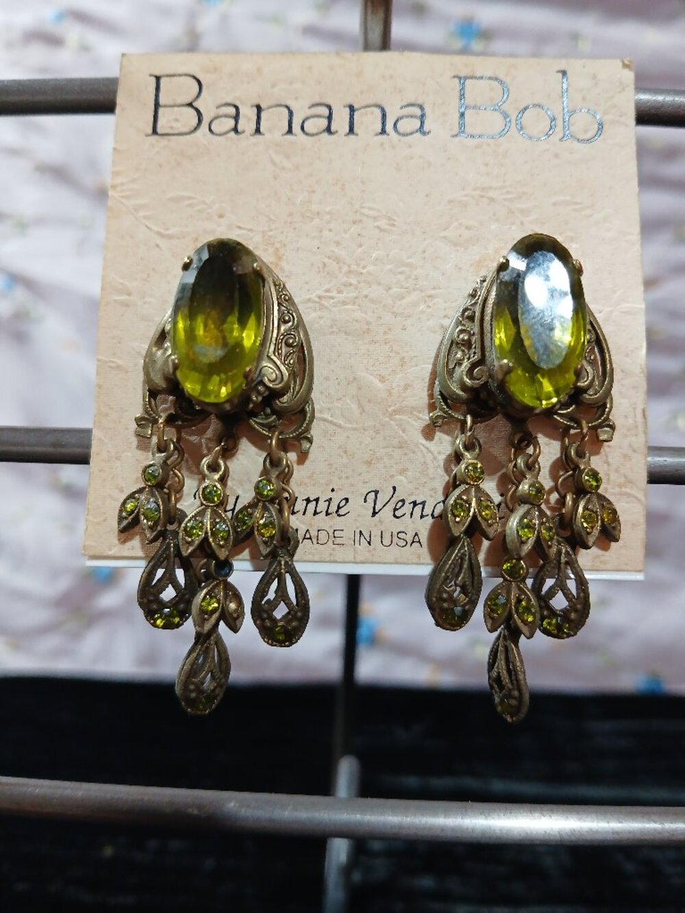 Vintage Banana Bob gold clip earrings w/ green setting & dangles